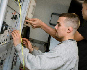Student working with electronic equipment
