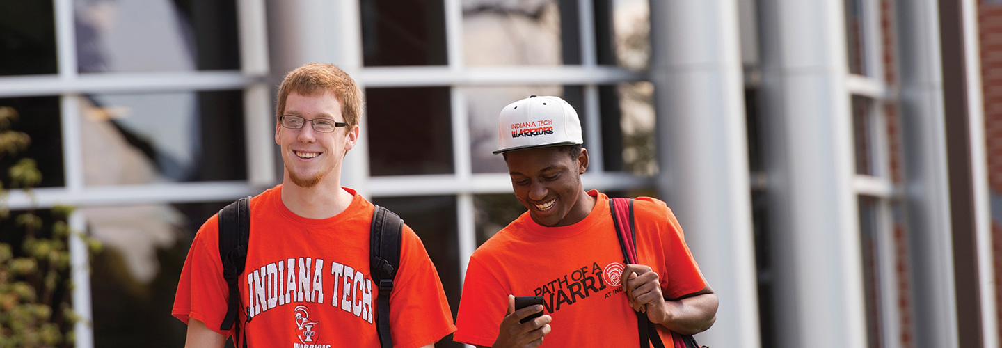 Two students walking on campus